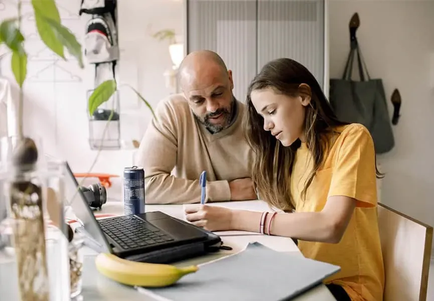 Dad helping daughter do her homework