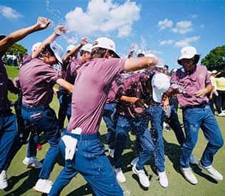 Laurel Springs Senior Ethan Gao gets celebrated by team mates on the field.