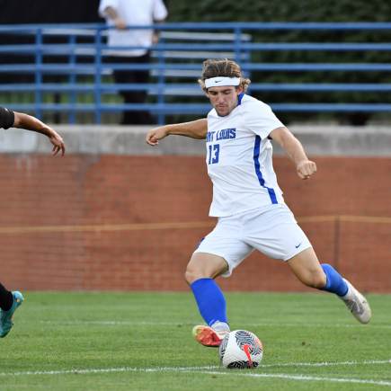 Jason Delkus about to strike soccer ball during a game