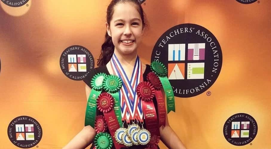 Student Coral Coco Chapman wearing several medals and ribbons