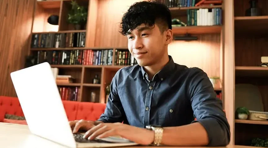 Male at home on laptop