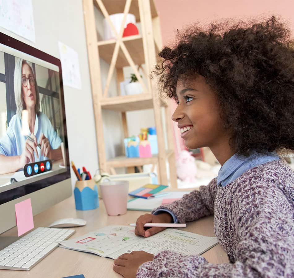 grinning female student in a video conference