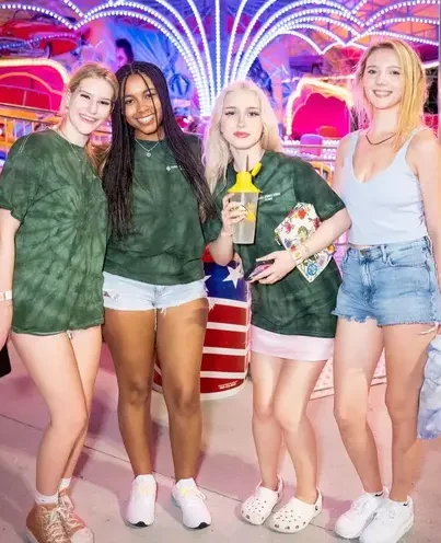 4 female students at a carnival