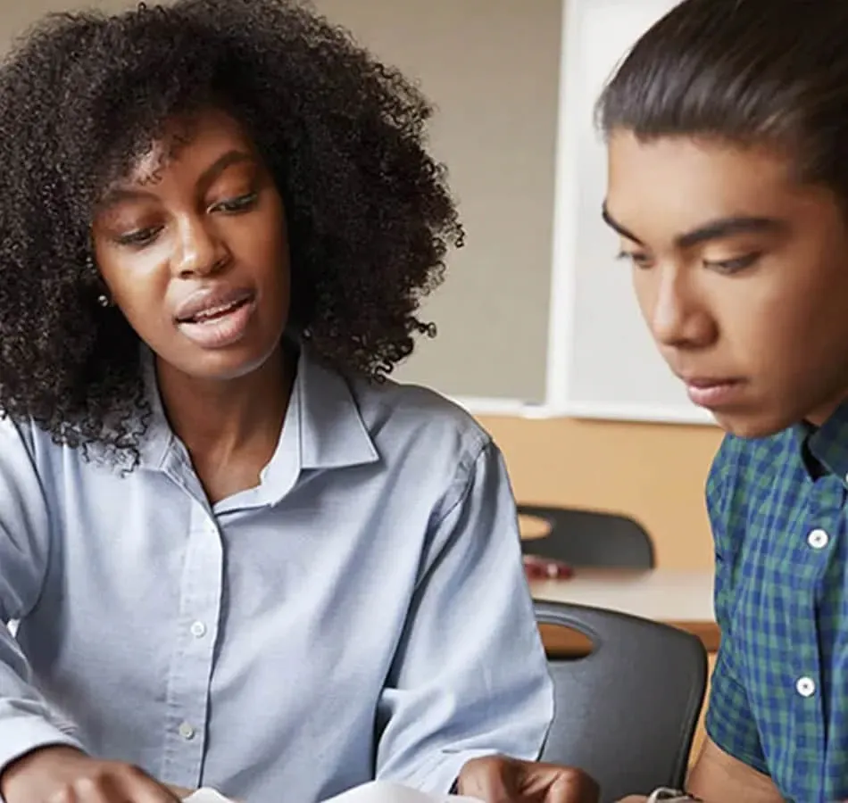 Teacher helping student with homework